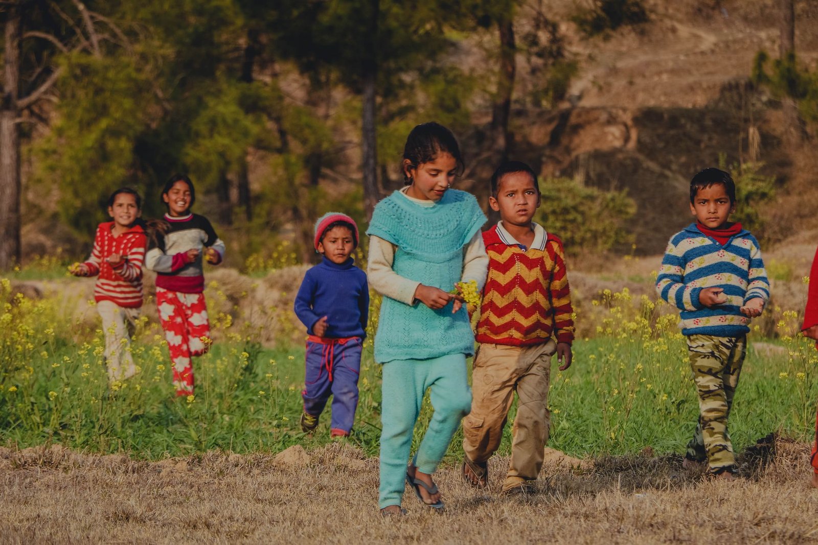 Children running through an open field