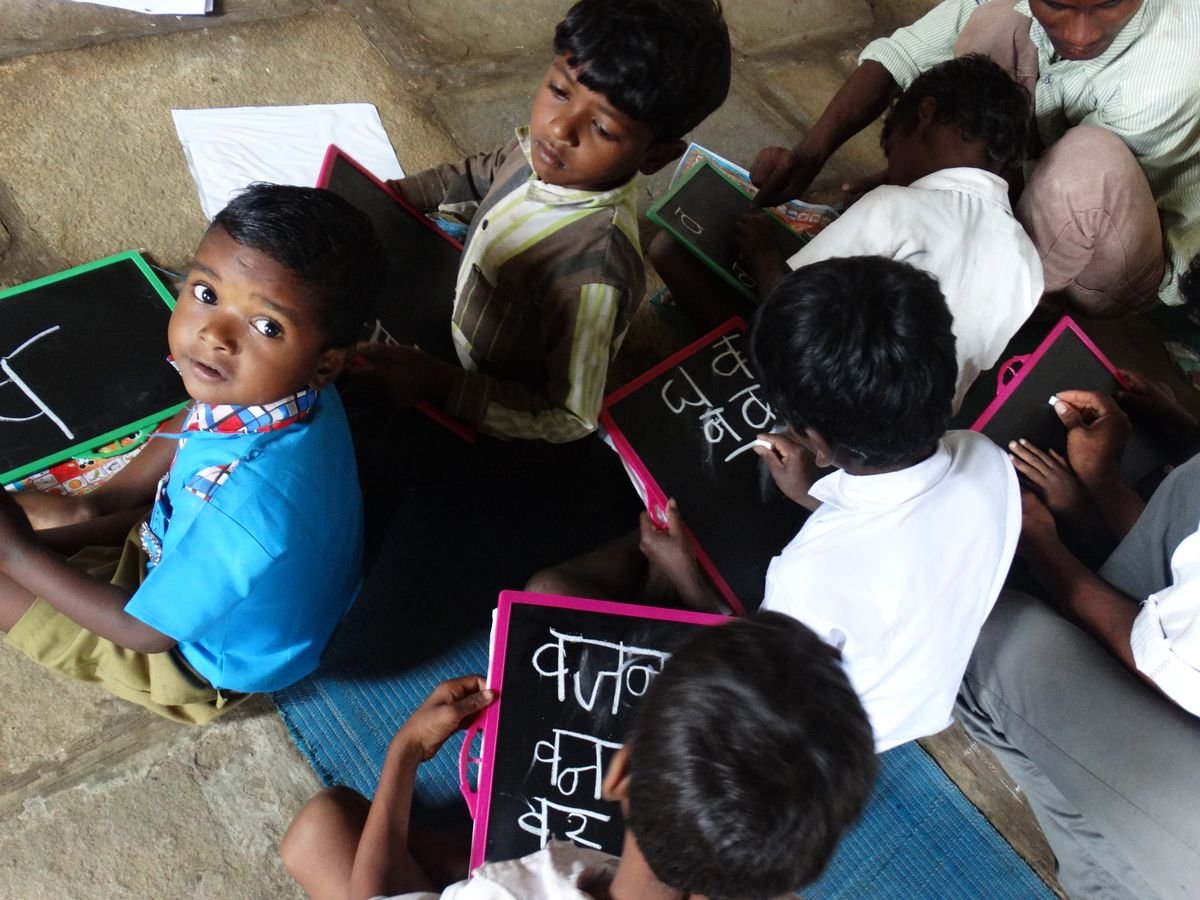 Children writing on slates