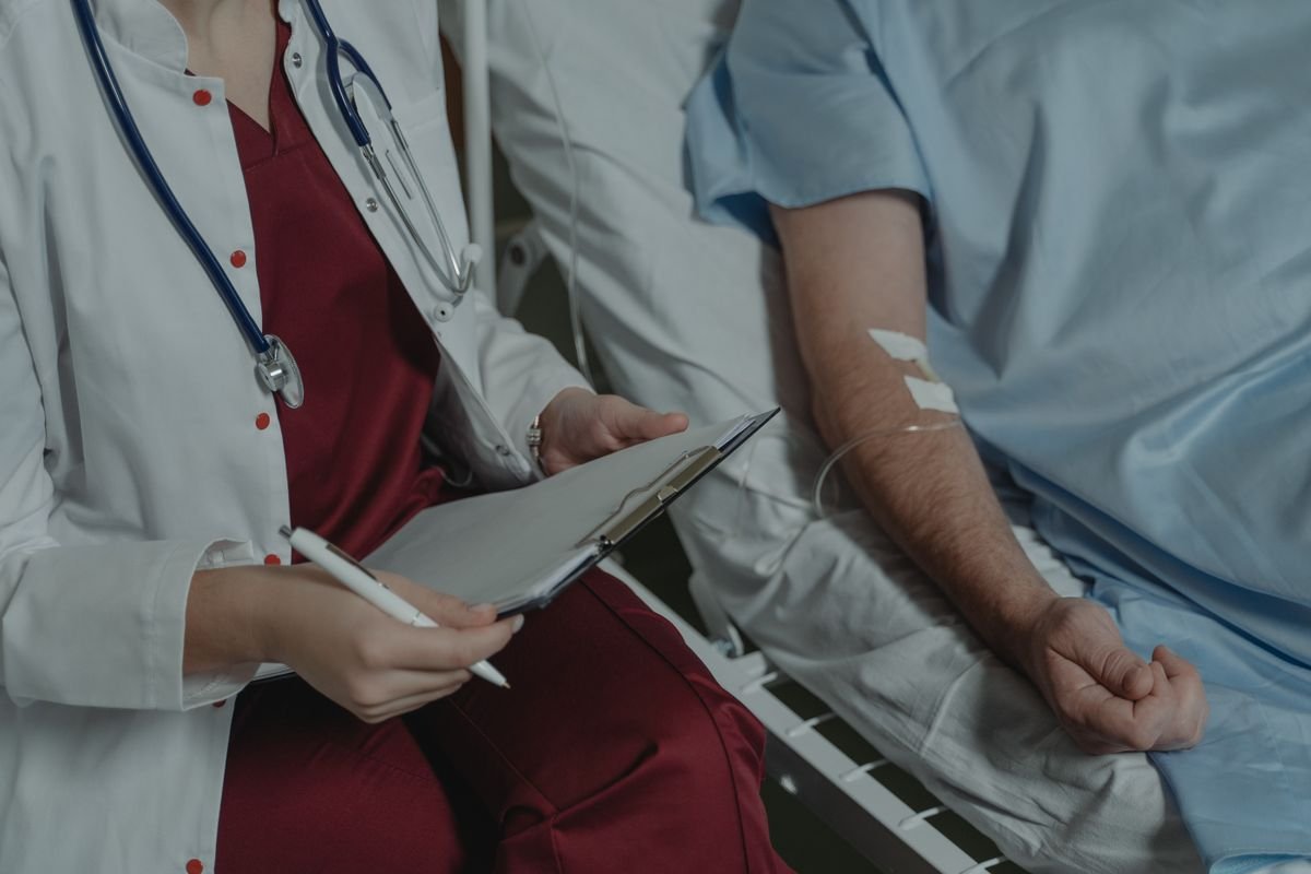 A clinician with a patient